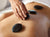 Massage with warm stones